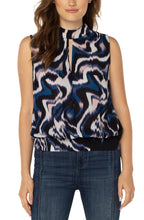 Load image into Gallery viewer, This beautiful floating ink printed top in nautical blue, black, white and soft pink is a fabulous statement piece featuring a mock neck slit and smocked waistband. With a great fit, providing all day comfort, our Mandi can be worn alone or under your favorite jacket or blazer. An outstanding outfit includes this top paired with your favorite white bottom. Color- Floating Ink; Blue, black, white and soft pink. Split front. Sleeveless. Banded elastic bottom. Blousy design. Not stretch fabrication.