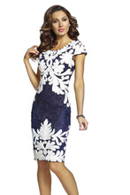 Load image into Gallery viewer, Turn heads when you walk into a room when you dress in this stunning embroidered dress by Frank Lyman. The stunning white and navy floral applique on the front of the fitted bodice elevates this design to a whole new level. A dress meant to stand out in a crowd, you will feel confident and beautiful when you wear this captivating dress to a special event.