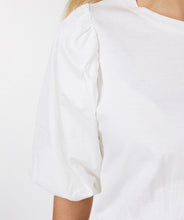 Load image into Gallery viewer, We love the elevated take on a simple t-shirt. The blouson sleeves are a spectacular feature on our Odelia, creating a feminine and stylish look. Be prepared to receive compliments when you style this top with your favorite bottom. Color- Off-white. Pull-over. Bodice is t-shirt stretch material. Sleeves are more of a crisp cotton fabrication. Fabric-100% Cotton.