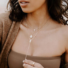 Load image into Gallery viewer, A gorgeous design on the New Lourdes Opal Necklace creates a lovely pendant that can be worn for all occasions. A gorgeous oval opal is surrounded by gold detailing and four cubic zirconia. The intricate chain has small gold beading. The beauty is in the details and our New Lourdes necklace is a beauty in its own right.