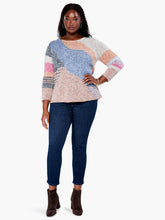 Load image into Gallery viewer, Just the right weight for the colder days of fall and winter, this gorgeous sweater will keep you cozy warm. We love the modern look of color blocks sewn together with intarsia knit. There's also some hidden detailing in the yarn itself, with flecks of darker shades running throughout. A classic crew neck, long sleeves, and a hem designed to sit at the hip completes the look. Color- Indigo multi-Gray, light blue, pink, coral, white. Pullover sweater. Intarsia knitting. Midweight.