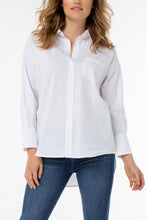 Load image into Gallery viewer, Effortlessly crisp and endlessly versatile, the Odeline Shirt by Liverpool Los Angeles brings modern ease to a timeless staple. Crafted in a soft, lightweight cotton blend with just enough drape, this oversized classic features a pointed collar, button-front closure, three-quarter sleeves with a tailored cuff that hits mid-forearm for soft structure and a relaxed drop-shoulder silhouette. Wear it tucked, tied, or layered—this piece is your go-to for polished, low-effort style.