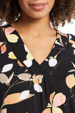 Load image into Gallery viewer, Let's hear it for comfy tees that go the extra style mile! We are crushing hard on this pretty printed top that's brimming with design details that elevate it to the next level—a flattering V-neck, relaxed fit, and side slits make it an effortless piece, while the ladder tape details add a dash of flair and make this a standout top that you'll want to wear everywhere your days take you.
