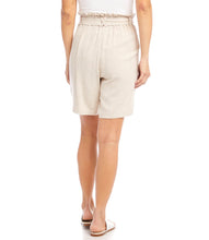 Load image into Gallery viewer, Casual yet polished, the Karen Kane Penelope Paperbag Waist Shorts feature a stylish ruffled paperbag waist with a belted tie and elastic waistband for adjustable comfort. Crafted from a soft linen-rayon blend, these shorts offer a relaxed fit and mid-thigh length, making them perfect for warm-weather outings. Front pockets add practicality to their chic design, while the natural beige color ensures versatile styling.