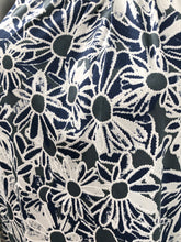 Load image into Gallery viewer, Daisies in navy, white and gray dance on this lovely sleeveless top by Papillon. The color combination makes it a very versatile top to pair with so many different bottoms from jeans to skirts and everything in-between.
