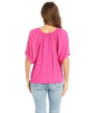 Load image into Gallery viewer, Your summer wardrobe is not complete without a top that offers a pop of color! This gorgeous azalea pink, short sleeve top, has a great deal of interest and beauty offering so many options when it comes to pairing with bottoms. Details include a subtle ruffle edging around the neckline, front ties and cuffs at the sleeve, creating a lovely feminine style.