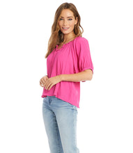 Load image into Gallery viewer, Your summer wardrobe is not complete without a top that offers a pop of color! This gorgeous azalea pink, short sleeve top, has a great deal of interest and beauty offering so many options when it comes to pairing with bottoms. Details include a subtle ruffle edging around the neckline, front ties and cuffs at the sleeve, creating a lovely feminine style.