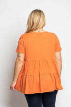 Load image into Gallery viewer, A lovely orange color makes this tiered baby doll top really pop! A comfortable fit, our Kenna makes an ideal top to pair with so many different bottoms.