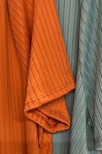 Load image into Gallery viewer, A lovely orange color makes this tiered baby doll top really pop! A comfortable fit, our Kenna makes an ideal top to pair with so many different bottoms.