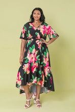 Load image into Gallery viewer, The Ellie Woven Maxi Dress is so stunning with a black background and a floral print that just pops! This gorgeous style features a surplice neckline and is a true wrap design with a ruffled hemline. A dress for those perfect moments in your life.