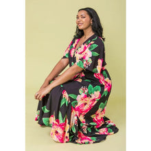 Load image into Gallery viewer, The Ellie Woven Maxi Dress is so stunning with a black background and a floral print that just pops! This gorgeous style features a surplice neckline and is a true wrap design with a ruffled hemline. A dress for those perfect moments in your life.