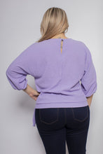 Load image into Gallery viewer, A lovely lavender color top, our Leeann faux wrap side tie blouse is a perfect top for every season. With the lightweight linen feel, you will be sure to remain cool and comfortable during those hot, humid days while looking stylish. The details are in the design and this top does not disappoint with its faux wrap front and side tie, stretch banded bottom and 3/4 sleeves. A keyhole button closure is found in the back at the neckline. Color- Lavender. 3/4 sleeves.