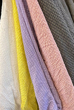 Load image into Gallery viewer, A lovely lavender color top, our Leeann faux wrap side tie blouse is a perfect top for every season. With the lightweight linen feel, you will be sure to remain cool and comfortable during those hot, humid days while looking stylish. The details are in the design and this top does not disappoint with its faux wrap front and side tie, stretch banded bottom and 3/4 sleeves. A keyhole button closure is found in the back at the neckline. Color- Lavender. 3/4 sleeves.