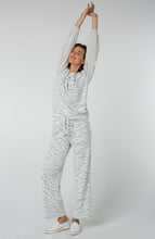 Load image into Gallery viewer, Sometimes, what you desire is just a casual and comfortable but fashionable outfit. Our Windam pull on pant in zebra print meets all those needs and more! With its soft fabrication, pull on ease, elastic waistband and drawstring closure, you can quickly get ready to face your day and run your errands.
