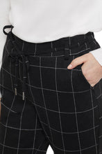 Load image into Gallery viewer, pant that is extra comfortable and has the perfect classic look, is a definite yes! You'll want to wear this pull-on pant over and over again as it offers just the right look for so many different occasions, including holiday get togethers! Color- Black and white. Black with thin white plaid stripe. Pull-on, elastic waist pant with removable corded belt. Rounded hemline. Front functional pockets.