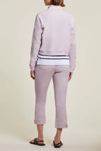 Load image into Gallery viewer, An easy and stylish crop, our Posie pull on crop in a beautiful soft lilac color called grapemist will become your go to pant of the season. Perfect stretch and a button tab accent detail at the hemline gives this pant an edge. Pair with your favorite white or black tee and a pair of tennis shoes or sandals and you're ready to face the day in style. Color- Grapemist; soft lilac. Perfect stretch. Pull-on.