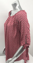 Load image into Gallery viewer, Our Rylee Raspberry Tie Sleeve Top is so versatile. With a raspberry and tan color geometric pattern, you create so many different looks with this lovely top. Pair with tan, white or black bottoms to create a dressier look or wear with jeans for a more casual look.