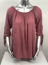 Load image into Gallery viewer, Our Rylee Raspberry Tie Sleeve Top is so versatile. With a raspberry and tan color geometric pattern, you create so many different looks with this lovely top. Pair with tan, white or black bottoms to create a dressier look or wear with jeans for a more casual look.
