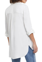 Load image into Gallery viewer, There's nothing better than a flowy tunic top to elevate any outfit! This flowy white button up shirt has all the classic details we love including a hidden button placket, roll-up tab cuffs, a chest patch pocket and curved shirttail hem on a high lo look. Proudly wear on its own or put under a sweater vest, which is this season's hottest look!