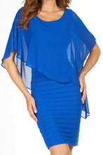Load image into Gallery viewer, Woman wearing a blue dress against a white background.
