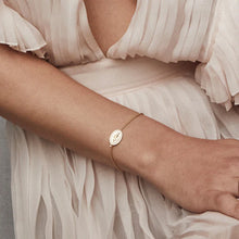 Load image into Gallery viewer, Featuring an oval silhouette pendant, the Saint Mary bracelet highlights Virgin Mary in the center of the drop pendant and is surrounded by cubic zirconia. Perfect to wear as a statement piece.