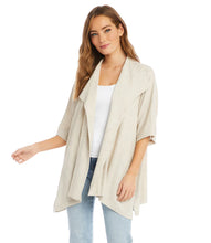 Load image into Gallery viewer, The Karen Kane Sabrina Jacket is a versatile layering piece crafted from a breathable linen-rayon blend. This stylish jacket features oversized lapels and a draped design for a chic finish. Its short sleeves and natural beige color make it perfect for pairing with a variety of tops, whether you're heading to lunch with friends or dressing up for work. Lightweight and comfortable, this jacket is a must-have addition to your wardrobe.
