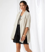 Load image into Gallery viewer, The Karen Kane Sabrina Jacket is a versatile layering piece crafted from a breathable linen-rayon blend. This stylish jacket features oversized lapels and a draped design for a chic finish. Its short sleeves and natural beige color make it perfect for pairing with a variety of tops, whether you're heading to lunch with friends or dressing up for work. Lightweight and comfortable, this jacket is a must-have addition to your wardrobe.