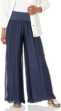 Load image into Gallery viewer, Our beautiful Nadia palazzo pant has an amazing knit fabric underneath a silk overlay. A flowy and relaxed fit gives this fabulous pant both style and comfort at the same time. Wear to the beach or to lunch, out to dinner, or a garden party or wear just lounge around the house, you can't go wrong with this stunning pant. Pair with our M Made In Italy silk tops for a complete fashionable look! Color- Navy. Boho, relaxed fit.