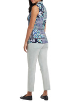 Load image into Gallery viewer, We love this easy sleeveless blouse in the softest printed woven fabric. Gorgeous blues, yellow, green and white colors come together to create an eye appealing medley of color while a front tie defines the waist. Dress this top up for work or wear casually while running errands, this stunning flowy top is a must have in your wardrobe. Color- Lagoon; white, blues, green, yellow. Pop-over V-neck. Flowy fit. Faux front tie.
