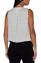 Load image into Gallery viewer, This classic dot printed top features a draped front for the most flattering fit. The V-neck design elevates the look of this lovely sleeveless top. A perfect top to match with so many different bottoms from jeans to dress pants. Create the perfect outfit when paired with our Black Sena Boyfriend Blazer with Princess Seams by Liverpool LA and our Black Kelsey Knit Trouser by Liverpool LA.