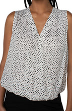 Load image into Gallery viewer, This classic dot printed top features a draped front for the most flattering fit. The V-neck design elevates the look of this lovely sleeveless top. A perfect top to match with so many different bottoms from jeans to dress pants. Create the perfect outfit when paired with our Black Sena Boyfriend Blazer with Princess Seams by Liverpool LA and our Black Kelsey Knit Trouser by Liverpool LA.