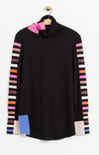 Load image into Gallery viewer, Striped sleeves on our Sena turtleneck create a dramatic look that will turn heads. Other extraordinary details add even greater interest including color patches at the hem and turtleneck. The bright vivid colors on this fabulous sweater will make you happy every time you wear it. Colors- Black multi- blue, white, pink ,orange, tan. Pullover sweater. Knit in squares detail. Regular fit. Turtleneck. Long sleeve