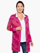 Load image into Gallery viewer, The Sun Chaser Cardigan sweater features an artistic, one-of-a-kind jacquard knit with colors that are joyful, bright and expressive. This cozy cardigan is designed with a soft, midweight yarn which has an easy, relaxed fit. Color- Multi pink. Cardigan sweater with open front. Jacquard knit with original artwork. Midweight. Relaxed fit. Shawl collar.