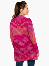 Load image into Gallery viewer, The Sun Chaser Cardigan sweater features an artistic, one-of-a-kind jacquard knit with colors that are joyful, bright and expressive. This cozy cardigan is designed with a soft, midweight yarn which has an easy, relaxed fit. Color- Multi pink. Cardigan sweater with open front. Jacquard knit with original artwork. Midweight. Relaxed fit. Shawl collar.