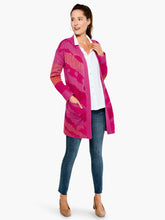 Load image into Gallery viewer, The Sun Chaser Cardigan sweater features an artistic, one-of-a-kind jacquard knit with colors that are joyful, bright and expressive. This cozy cardigan is designed with a soft, midweight yarn which has an easy, relaxed fit. Color- Multi pink. Cardigan sweater with open front. Jacquard knit with original artwork. Midweight. Relaxed fit. Shawl collar.