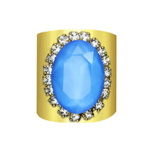 Load image into Gallery viewer, Our Sydney ring includes a breathtaking powder blue Swarovski oval crystal that grandly sits atop a wide antique gold adjustable band. A definite statement piece, this will add a pop of pizazz to any outfit!