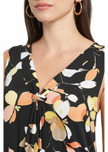 Load image into Gallery viewer, A gorgeous dress with utmost comfort during those hot, humid days is a must have in your summer wardrobe. A flattering fit for all figures, the Ellie dress tapers down from a small gathering at the end of the V-neck and gracefully flares from there. The most darling leaf pattern in colors of papaya, black and cream and adorn this gorgeous sleeveless dress.