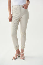 Load image into Gallery viewer, The latest in fashion is embellished and frayed jeans and our Christina Crystal Patch Jean by Joseph Ribkoff meets both of these trends. Patch embellishments in moonstone crystals can be found on both legs while slightly cuffed legs with moonstone embellishments dazzle with sparkle. Not your ordinary jean, this sand colored, soft denim jean will become your next favorite!