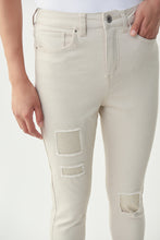 Load image into Gallery viewer, The latest in fashion is embellished and frayed jeans and our Christina Crystal Patch Jean by Joseph Ribkoff meets both of these trends. Patch embellishments in moonstone crystals can be found on both legs while slightly cuffed legs with moonstone embellishments dazzle with sparkle. Not your ordinary jean, this sand colored, soft denim jean will become your next favorite!