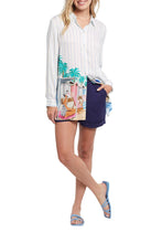 Load image into Gallery viewer, How absolutely darling and unique is our Janene top?! With the printed picture of ladies at the beach, it just makes one long for summer days and beach/pool time. This chic button-front tunic top serves up all the fashionable extras we love while keeping it easy, breezy, and effortless to wear. The 30' length makes it just right for endless outfit options that you can wear from day to night and always make the best-dressed list.