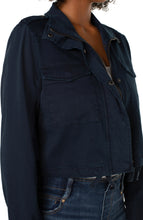 Load image into Gallery viewer, Liverpool's navy utility crop jacket, made with a stretch soft touch twill offers a modern take on a classic jacket. The design offers a touch of sass mixed with edge to give you styling versatility! Color- Federal Navy. Cropped. Collared. Double front patch pockets. Button and zip front closure. Button closure at wrists. Cinch waist drawstring.