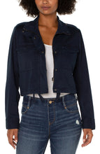 Load image into Gallery viewer, Liverpool's navy utility crop jacket, made with a stretch soft touch twill offers a modern take on a classic jacket. The design offers a touch of sass mixed with edge to give you styling versatility! Color- Federal Navy. Cropped. Collared. Double front patch pockets. Button and zip front closure. Button closure at wrists. Cinch waist drawstring.