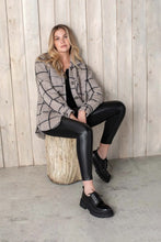 Load image into Gallery viewer, Take vegan leather and Ponte fabric, combine and you get a pair of leggings with an elevated look. A versatile style, these leggings will go with so many of your favorite wardrobe pieces including sweaters and jackets. These spectacular leggings will easily become your next favorite! Color-Black. Pull-on elastic waistband. Fitted legging. 10 1/4" mid-rise.