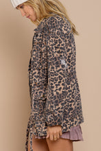 Load image into Gallery viewer, If you are looking for something new with a vintage vibe, our Virginia jacket is the perfect transitional jacket for you. Designed with a relaxed fit, the Virginia jacket has a hidden placket and zipper closure on center front and a great leopard print. Comes with a four-pouch pocket on front with an adjustable strap on the waistband and finished with distressed detail throughout the garment for vintage look. Color-Light brown base with black leopard print. Relaxed fit; no stretch.