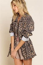 Load image into Gallery viewer, If you are looking for something new with a vintage vibe, our Virginia jacket is the perfect transitional jacket for you. Designed with a relaxed fit, the Virginia jacket has a hidden placket and zipper closure on center front and a great leopard print. Comes with a four-pouch pocket on front with an adjustable strap on the waistband and finished with distressed detail throughout the garment for vintage look. Color-Light brown base with black leopard print. Relaxed fit; no stretch.