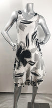 Load image into Gallery viewer, A classic dress, this black, white and gray biased cut dress will easily become your next favorite. A lovely abstract floral pattern adorns this two-tier hem dress and with the sleeveless design, you can easily style with a cardigan or jacket. Fully lined.