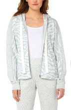 Load image into Gallery viewer, A soft and comfortable fabric, along with a stylish pattern, makes our Zora jacket a must have for the cooler months. Layer over a white or gray top and pair with your favorite jean or if you are looking for a complete fashionable set, pair with our WINDAM PULL ON WIDE LEG PANT WITH DRAWSTRING IN ZEBRA JACQUARD. Color- White and gray. Jacquard fabrication. Set in hooded neckline with drawstring. Long drop shoulder sleeves.