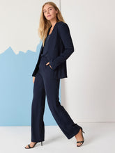 Load image into Gallery viewer, These versatile pants are perfect for dressing up or down, offering workday sophistication and weekend comfort. They feature a relaxed fit from the hip into a fashionable wide-leg silhouette, sit at the waist, and include a fly front with hook and bar closure. Equipped with slash and welt pockets, they provide ample space for all your essentials.
