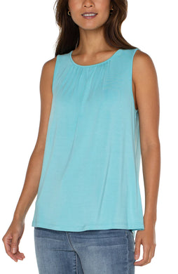 This elevated sleeveless top can be worn alone or under your favorite blazer. Elegant and classy with a versatile and minimalist silhouette.This elevated sleeveless top can be worn alone or under your favorite blazer, jacket or cardigan.  This sleeveless top is elegant and classy with a versatile and minimalist silhouette. The color is bright and bold.