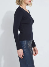 Load image into Gallery viewer, Model wearing a dark blue ribbed top and blue faux leather pants against a white background.
